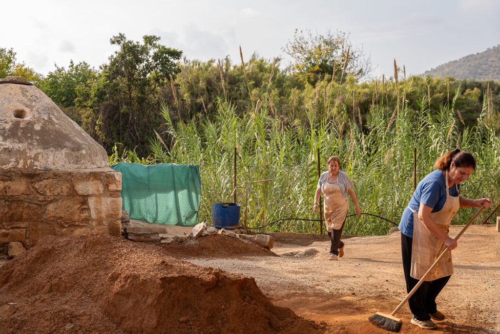 Two woment working outside by kiln